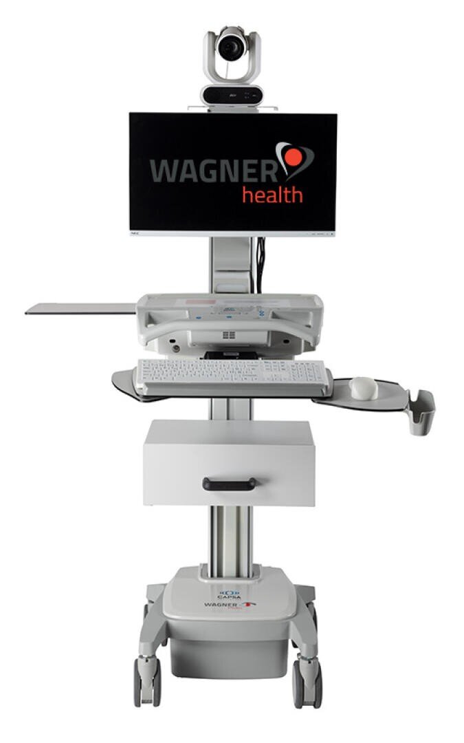 Ein medizinischer Telemedizin-Wagen mit einem Monitor, der Wagner Health anzeigt, einer Kamera auf der Oberseite, einer Tastatur, einer Schublade und einem Regal, der für die medizinische Fernbetreuung konzipiert ist. Der Wagen hat Räder für die Mobilität.